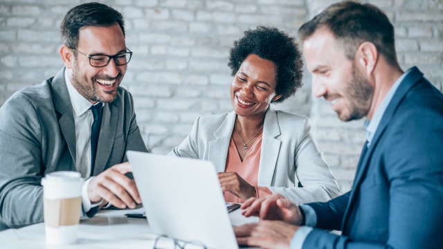 three people participating in a successful customer presentation